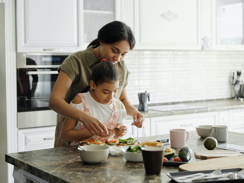 A family preparing and cooking a meal